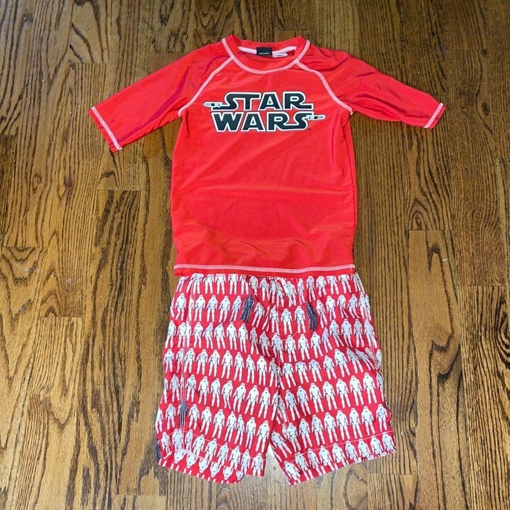 Star Wars rash guard and swim trunks. Size medium top and 6-7 bottoms.